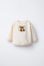 Zara ТОЛСТОВКА С АППЛИКАЦИЕЙ ИЗ ВИШНИ кремового цвета
