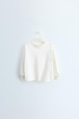 Zara ОДНОТОННАЯ ФУТБОЛКА TIMELESS С ИЗОБРАЖЕНИЕМ Бундхен Вэй?